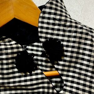 SUMMER SALE!!

Chic Checkered Sleeveless Top with Floral Detail